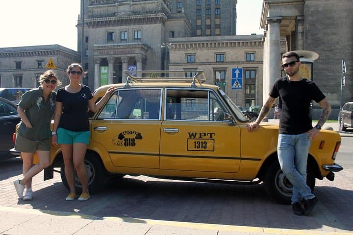 Retro Fiat 125p next to the Palace of Culture and Science