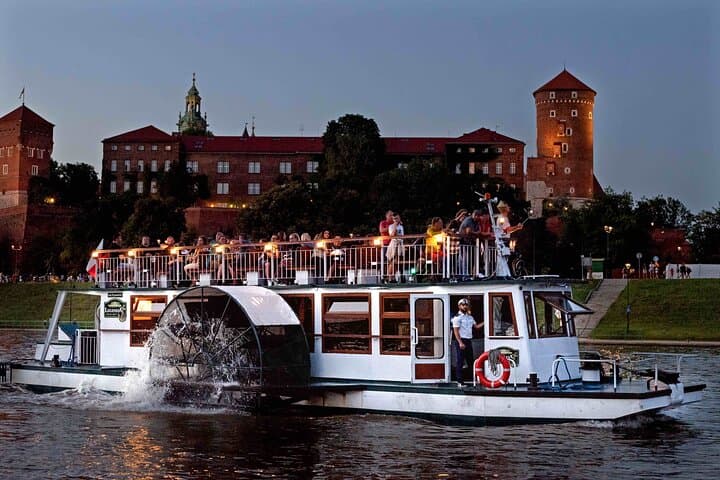 Side-wheeled ship - Legenda Boat against the background of the Wawel castle in Krakow